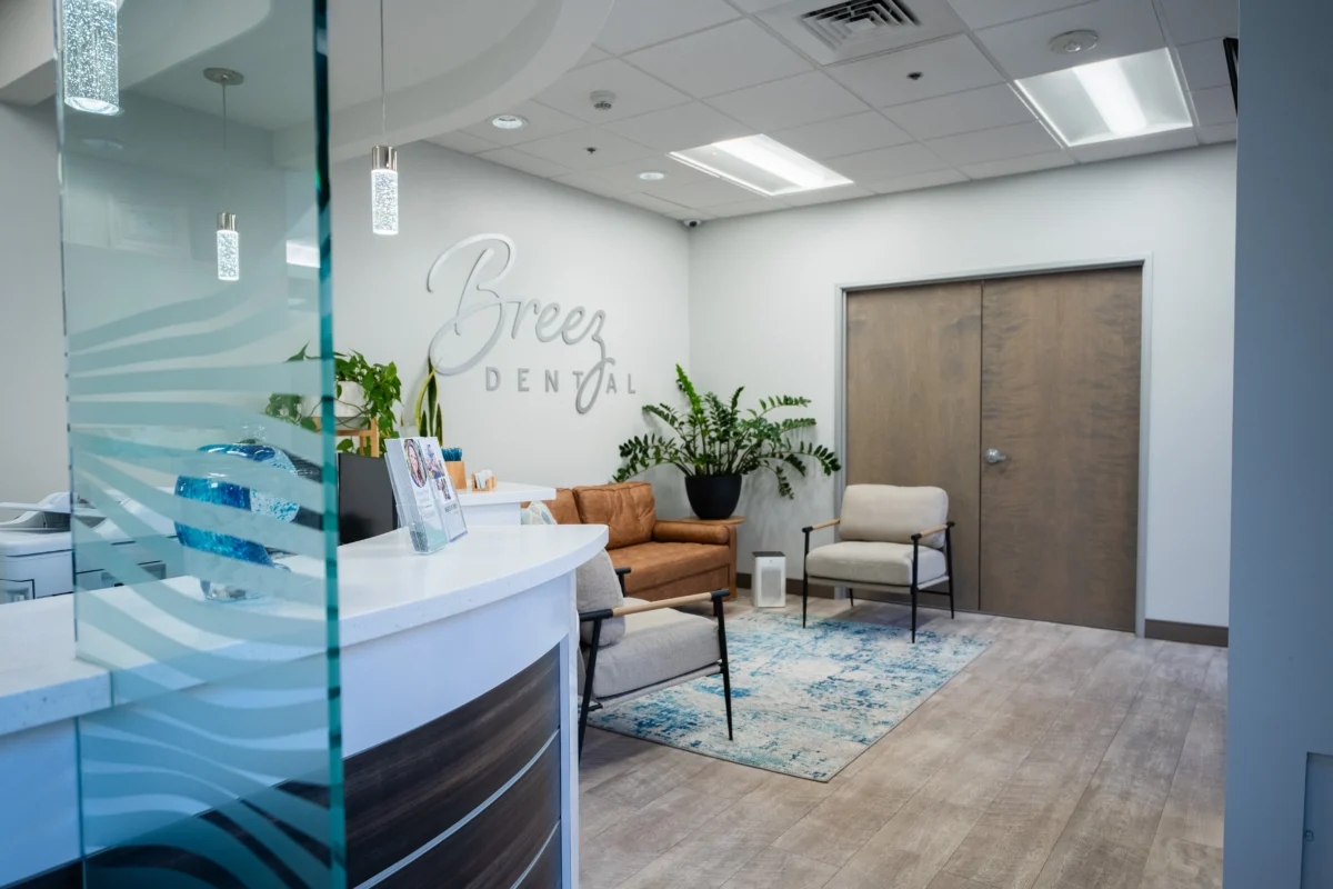 breez dental waiting area with modern decor, comfortable seating, and indoor plants