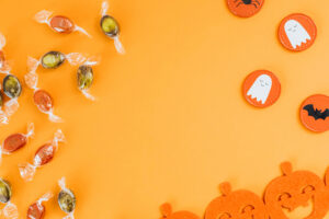 halloween candies in an orange background